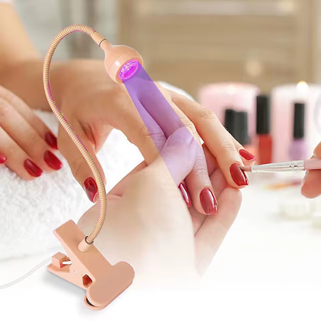 Flexible mini LED lamp - a clip-on flashlight for manicure peach color